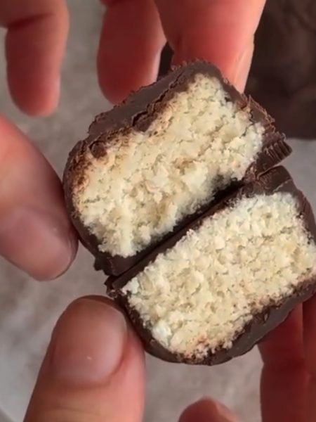 Chocolate-covered coconut bar, sliced open.