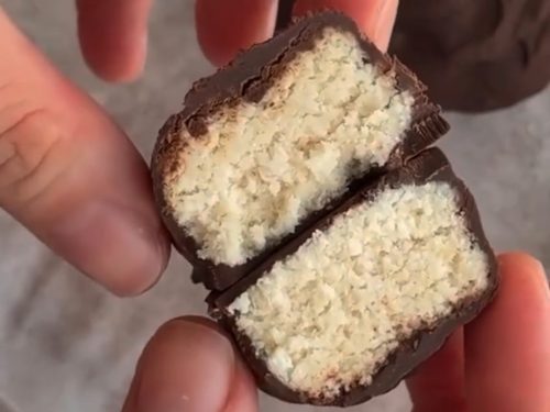 Chocolate-covered coconut bar, sliced open.
