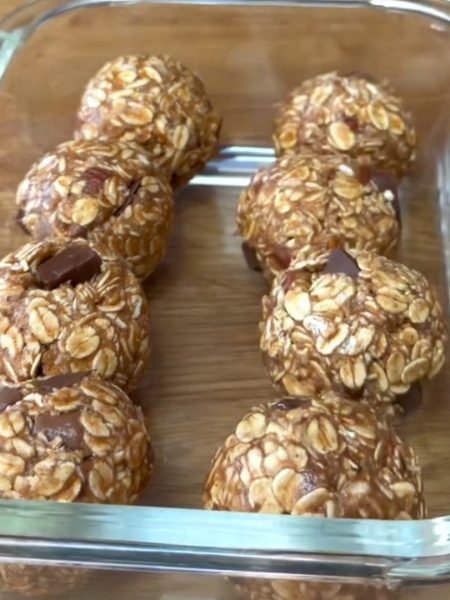 eight Peanut Butter Oatmeal Balls in a glass container