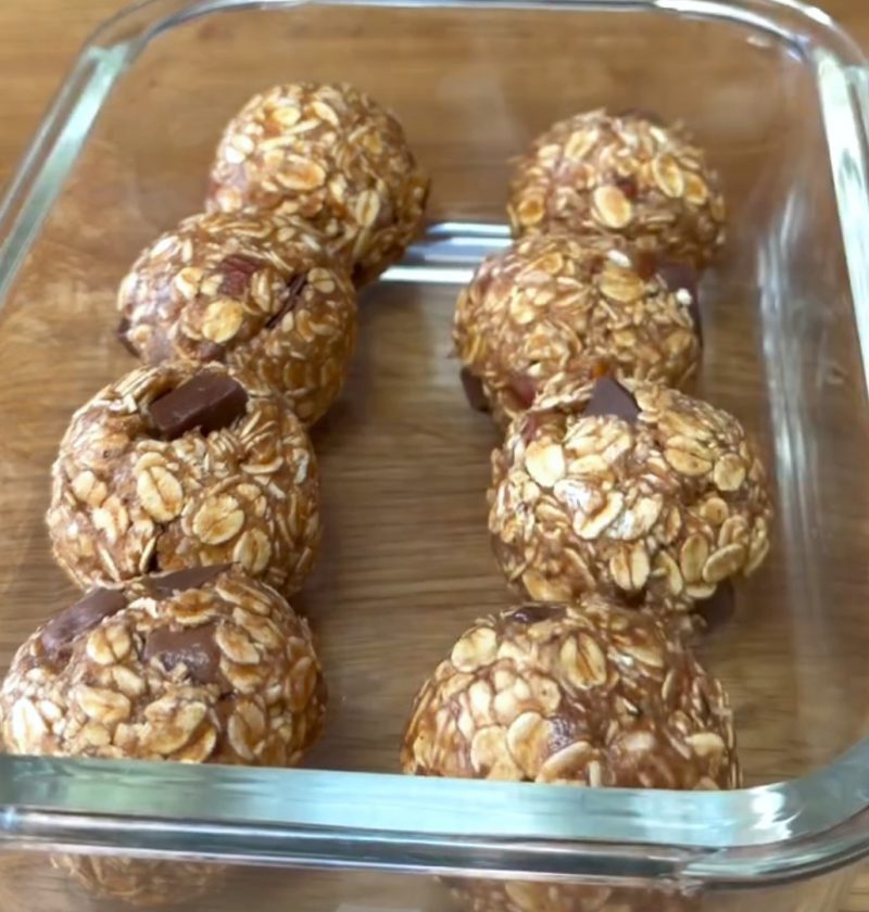 eight Peanut Butter Oatmeal Balls in a glass container
